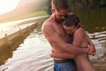 Lake romance. an affectionate young couple hugging while swimming in a lake. Royalty Free Stock Photo