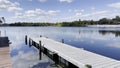 Lake Roy boat dock and reflections on Lake Roy Royalty Free Stock Photo