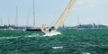 Lake Sailing and Sailboat Racing at speed in fair wind. Royalty Free Stock Photo