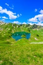 Lake Schrecksee - A beautiful turquoise alpine lake in the Allgaeu alps near Hinterstein, hiking destination in Bavaria, Germany Royalty Free Stock Photo