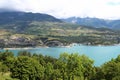 Lake Serre-Poncon in foggy mountain landscape, France