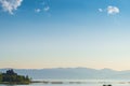 Lake Sevan, view of the mountains and the monastery on the shore of the reservoir in the morning Royalty Free Stock Photo