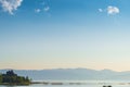 Lake Sevan, view of the mountains and the monastery on the shore of the reservoir in the morning