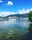 Lake shore with debris and boats docked. Royalty Free Stock Photo