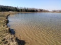 Lake shore spring march landscape blue sky background Royalty Free Stock Photo