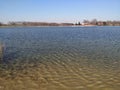 Lake shore spring march landscape blue sky background Royalty Free Stock Photo