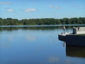 Lake shore summer landscape and fisherman in the Minsk Belarus blue sky background