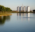 Lake with Silos in the Background Royalty Free Stock Photo