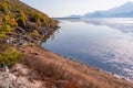 Lake Skadar - Idyllic peaceful coastline of lake in Skadar National Park on sunny autumn day seen from Vranjina, Montenegro