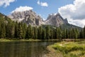 Lake and small wooden bridge in front of mountains Royalty Free Stock Photo