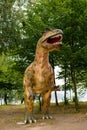 Portrait of a tourist attraction - an artificial dinosaur statue front view