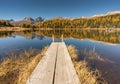 Beautiful mountain lake with a wooden pier near St. Moritz Royalty Free Stock Photo