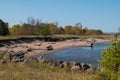 Lake Superior shore at Wisconsin Point, with blue water and autumn trees Royalty Free Stock Photo