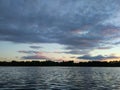 Lake surface at evening in Latvia, East Europe. Landscape with water and forest. Royalty Free Stock Photo