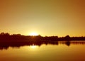 Lake surface at evening in Latvia, East Europe. Landscape with water and forest. Royalty Free Stock Photo