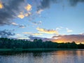 Lake surface at evening in Latvia, East Europe. Landscape with water and forest. Royalty Free Stock Photo