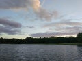 Lake surface at evening in Latvia, East Europe. Landscape with water and forest. Royalty Free Stock Photo