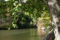 Lake surrounded by trees with bridge in the background in Central Park Royalty Free Stock Photo
