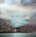 Lake Svartisvatnet and hazy cloudy view to Svartisen Glacier Meloy, Norway Royalty Free Stock Photo