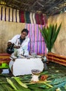Lake Tana, Ethiopia - Feb 05, 2020: Zege Peninsula in Lake Tana. Young woman is preparing a coffee ceremony