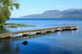 Lake Tarawera pier, New Zealand, with Mount Tarawera in the background