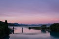 Lake Tekapo at sunset with the bridge above the lake and the southern alps behind. New Zealand Royalty Free Stock Photo