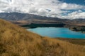 Lake Tekapo, valley and dramatic cloudy sky, North Island New Zealand Royalty Free Stock Photo