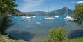 lake Thunersee with moored Sailboats, view to Niederhorn mountain, switzerland