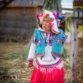 Young peruvian girl wearing traditional clothes on Uros island, Lake Titicaca, Peru Royalty Free Stock Photo