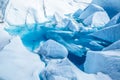 Lake on top of the Matanuska Glacier in Alaska. The deep blue water has flooded an old ice cave or moulin on the surface Royalty Free Stock Photo