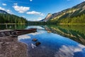 Lake tovel sunset landscape, with boat and mountains reflections, Italy