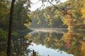 Lake and trees in autumn color in morning light in northern Minnesota Royalty Free Stock Photo