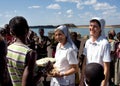 Nuns of Christian church buy handicrafts african tribe Royalty Free Stock Photo