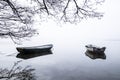 Two boats in quiet lake water Royalty Free Stock Photo