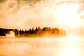 Lake of two rivers algonquin national park ontario canada sunset sunrise with fog foggy mystical atmosphere background Royalty Free Stock Photo