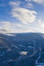 Lake Urise on a winter day with snowy nature at sunrise with cloudy sky Royalty Free Stock Photo