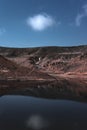 lake view of a dam among the plain of an arid climate with blue sky and few clouds, without people and animals, place of mountain