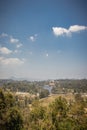 Lake view with green forest and blue sky