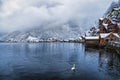 The lake and village of Hallstatt with snow and mist covered mountains, Austria Royalty Free Stock Photo