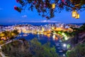 The lake Voulismeni in Agios Nikolaos at night with fullmoon, a picturesque coastal town with colorful buildings around the port.