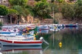 The lake Voulismeni in Agios Nikolaos, a picturesque coastal town with colorful buildings around the port.