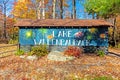 Lake Wallenpaupack clubhouse sign in Poconos PA on a bright fall day lined with trees