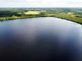 Lake water and green forest trees, aerial view. Summer landscape, beautiful nature, sunny day Royalty Free Stock Photo