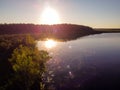 Lake water and green forest trees, aerial view. Summer landscape, beautiful nature, sunny day Royalty Free Stock Photo