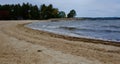 Beautiful lake waves and sandy shore landscape Royalty Free Stock Photo