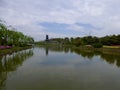 A lake with a windmill background at Shanghai flower port