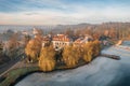 Lake in winter early morning with winter fogs in Zebrzydowice, Silesia, Poland with palace park, pier and frozen swimming pool. Royalty Free Stock Photo