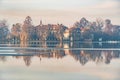 Lake in winter early morning with winter fogs in Zebrzydowice, Silesia, Poland with palace park, pier and frozen swimming pool. Royalty Free Stock Photo