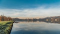 Lake in winter early morning with winter fogs in Zebrzydowice, Silesia, Poland with palace park, pier and frozen swimming pool. Royalty Free Stock Photo