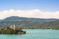 Lake Woerthersee with island and church in Austria Royalty Free Stock Photo